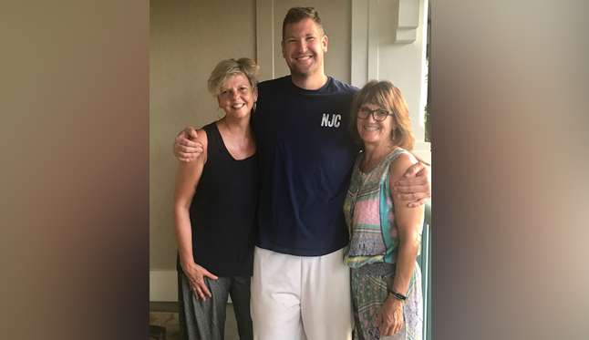 Jake Shoff hugs Pamela Crooke, right, and Michelle Garcia Winner, the two "angels" who saved his life on a river in Kauai. (Photo: Emily Shoff)