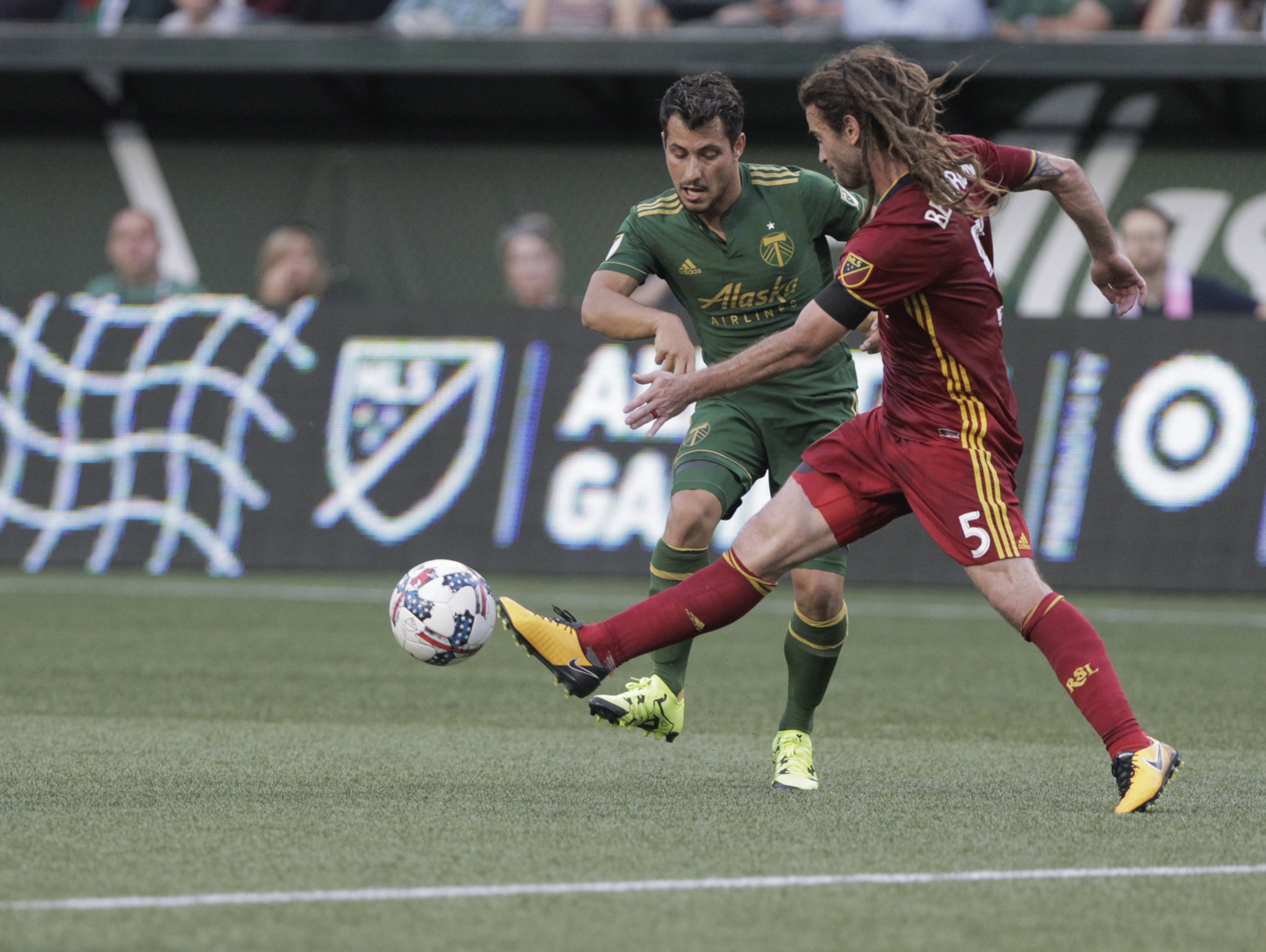 Real Salt Lake's Kyle Beckerman (5) knocks the ball away from Portland Timbers' Sebastian Blanco during an MLS soccer match Wednesday, July 19, 2017, in Portland, Ore.