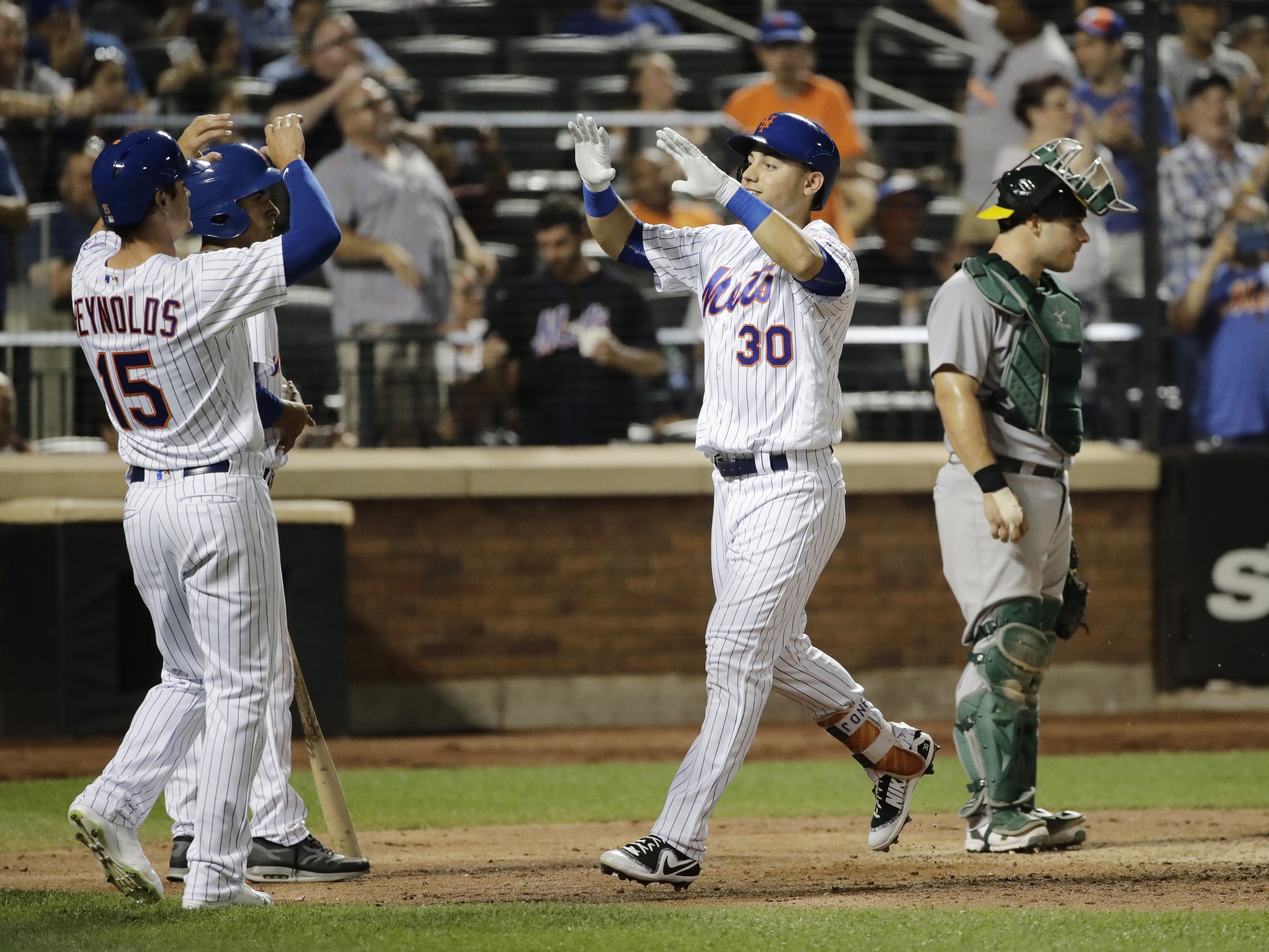 Conforto hits 2 HRs, Blevins helps Mets hold off A's 7-5