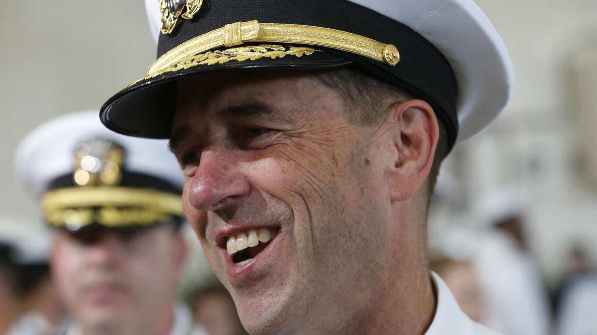 The Latest: Trump calls aircraft carrier a symbol of power