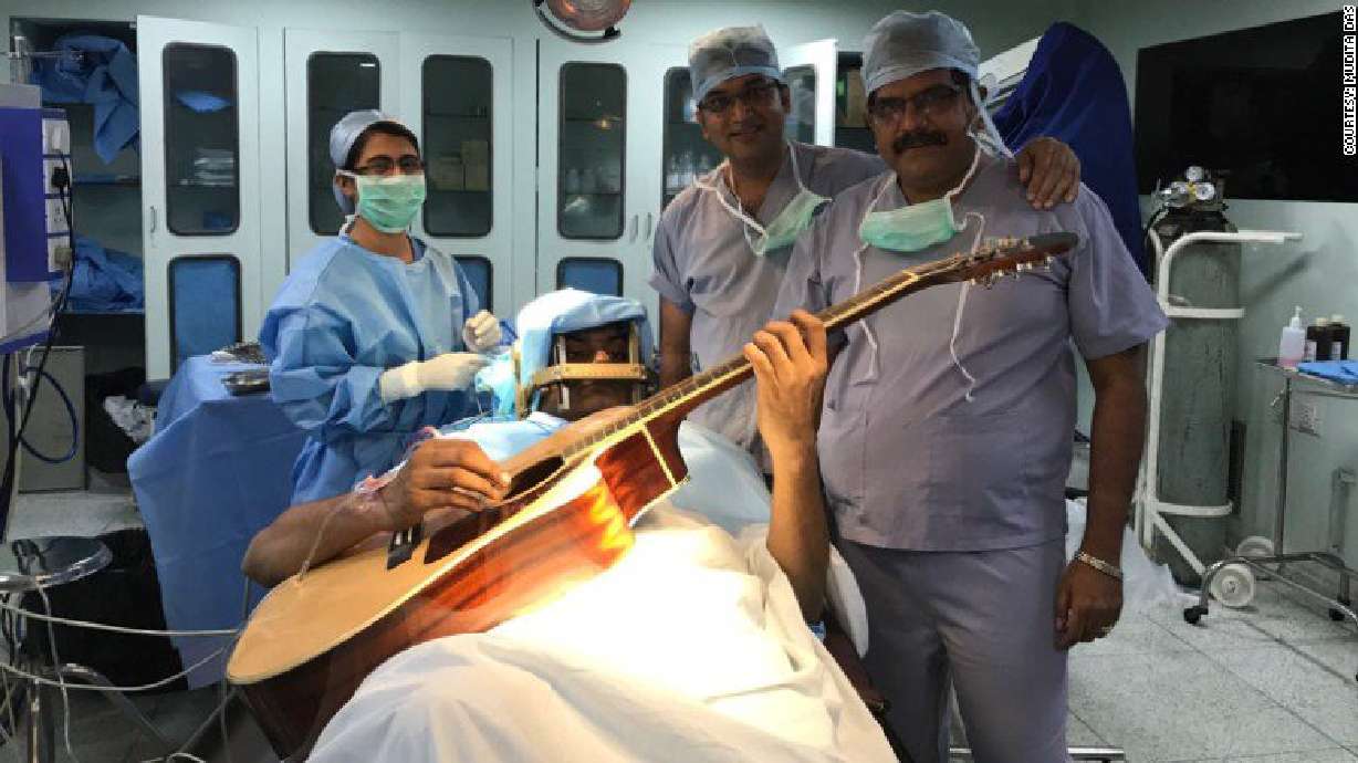 This musician strummed a guitar during his own brain surgery