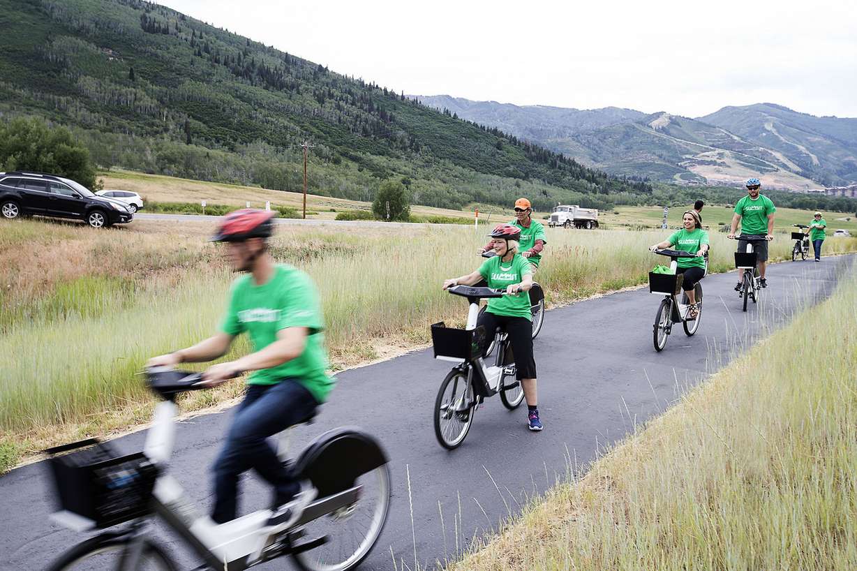 Summit County and Park City council members, along with other elected officials and local residents, ride from both the Old Town Transit Center and the Kimball Junction Transit Center to the McPolin Barn to launch the nation’s first fully electric bike-share program in Park City on Wednesday, July 19, 2017. (Photo: Laura Seitz, Deseret News)