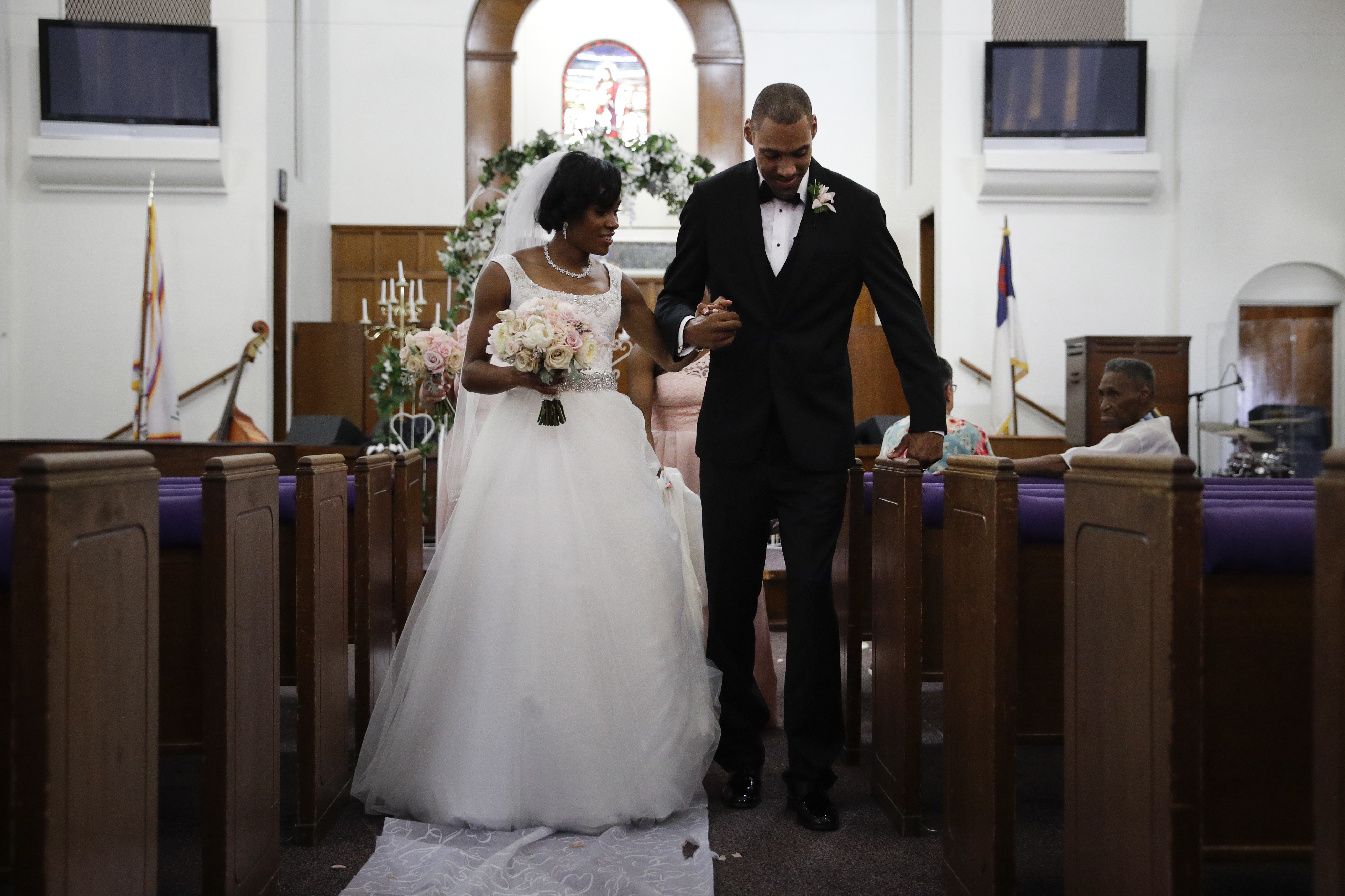Step by halting step, Nieto walks down aisle with his wife