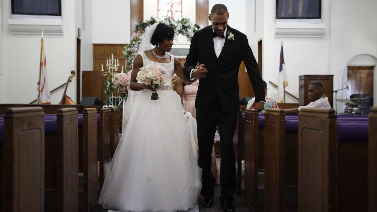 Step by halting step, Nieto walks down aisle with his wife