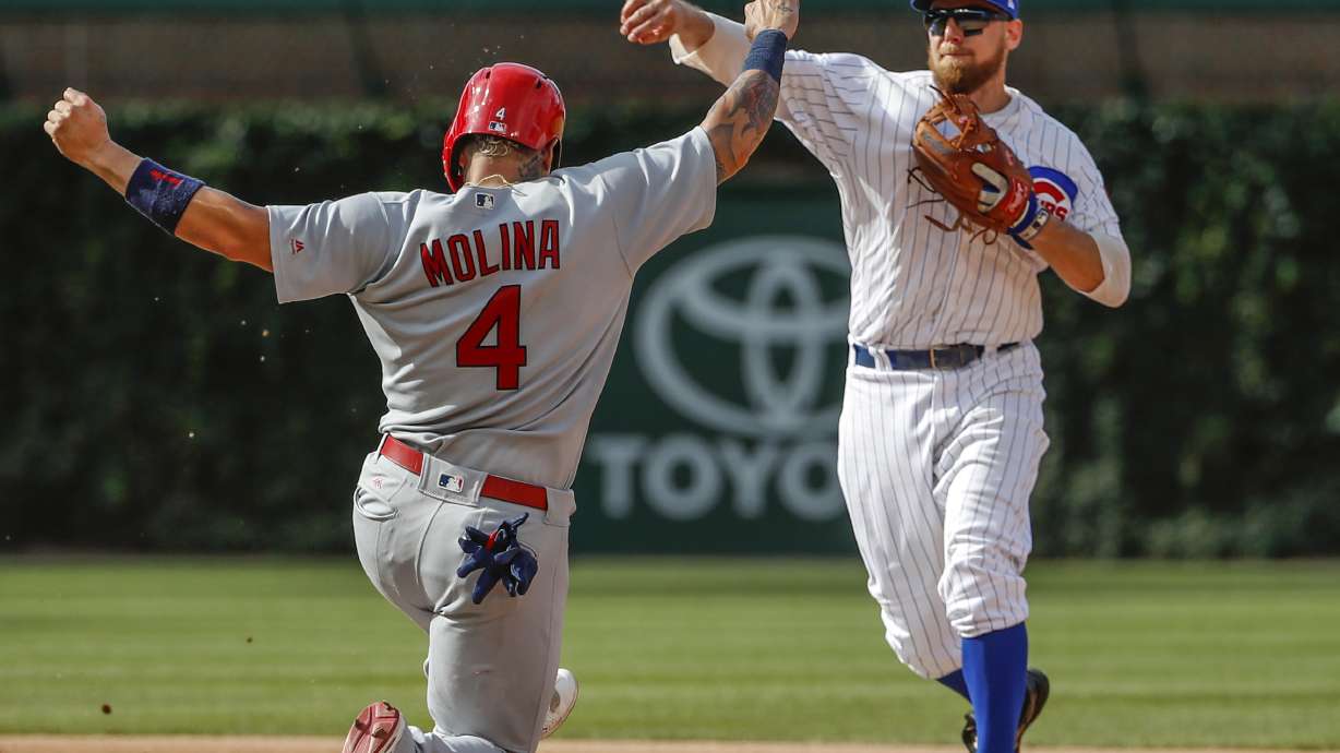 Bryant gallops home, Cubs rally in 8th, edge Cardinals 3-2