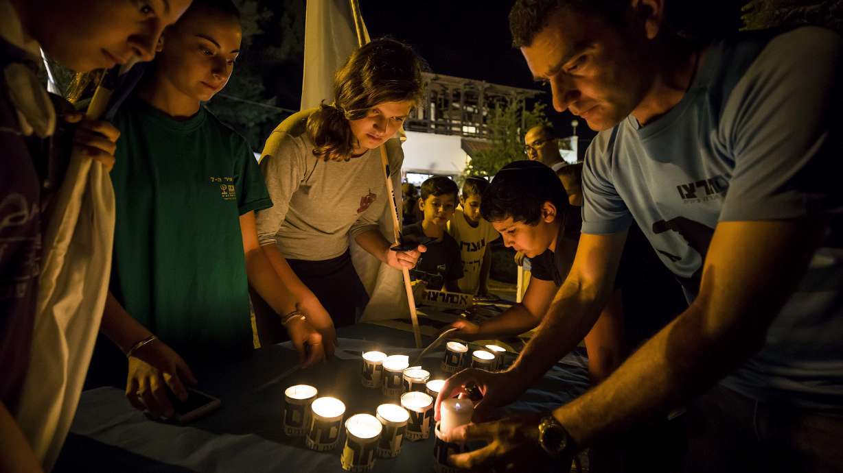 The Latest: Hamas leader praises 'heroic' knife attacker