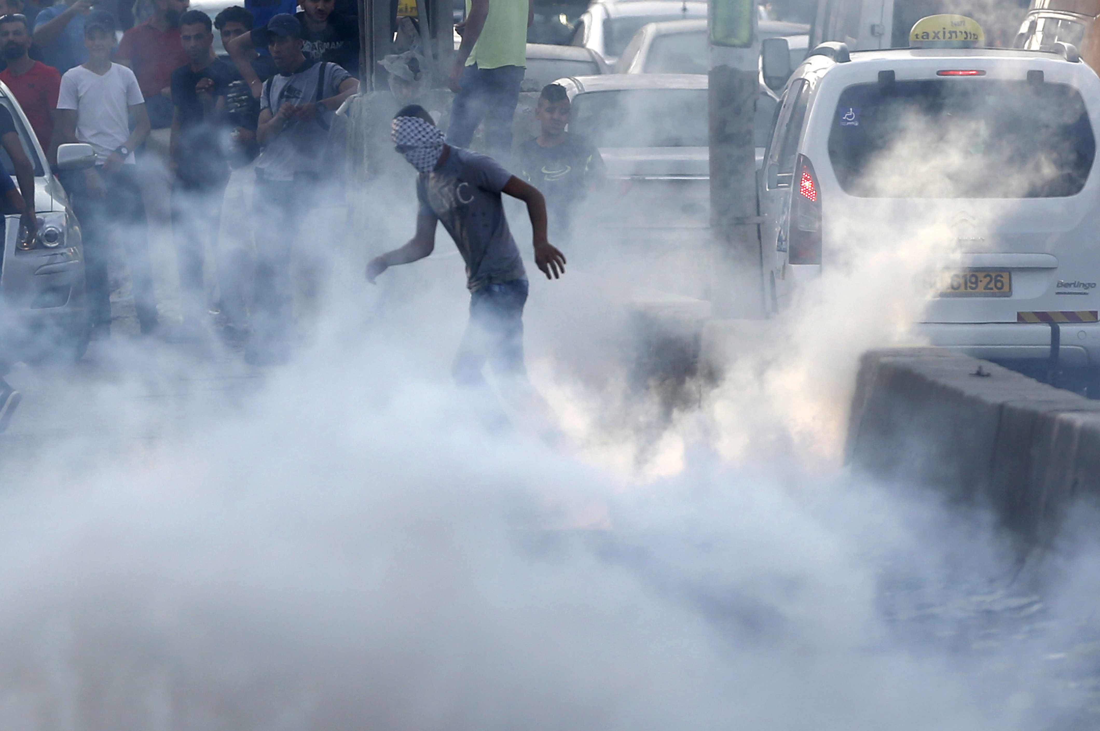 The Latest: Israel begins removing metal detectors from site