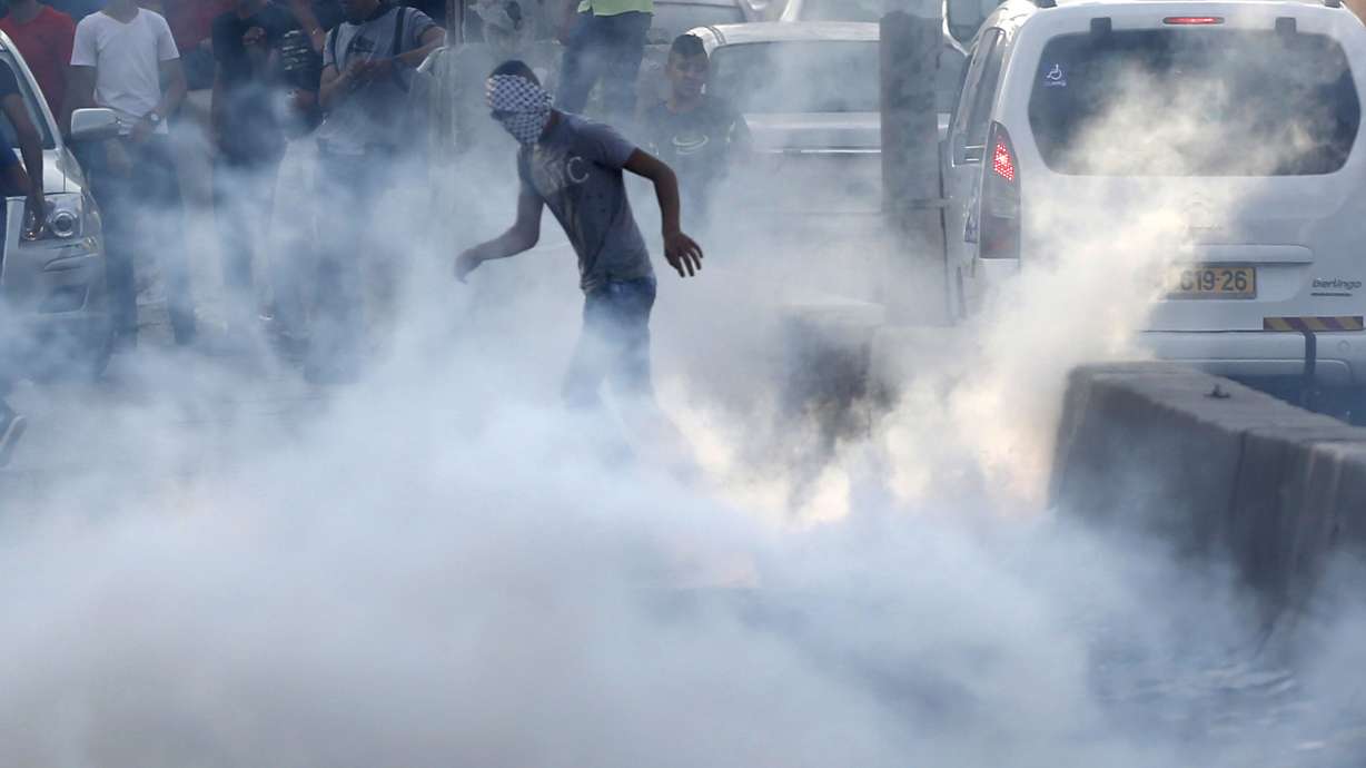 The Latest: Israel begins removing metal detectors from site