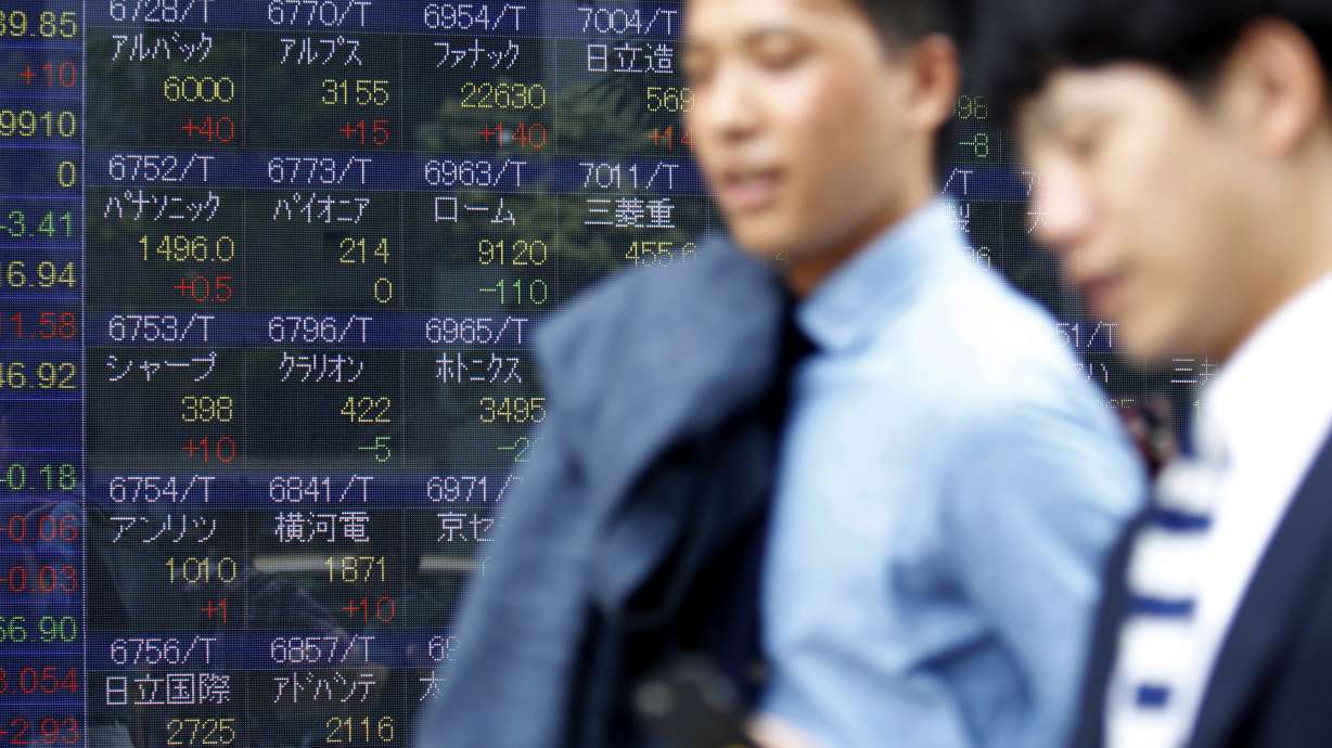 Global stocks mostly higher amid earnings reports