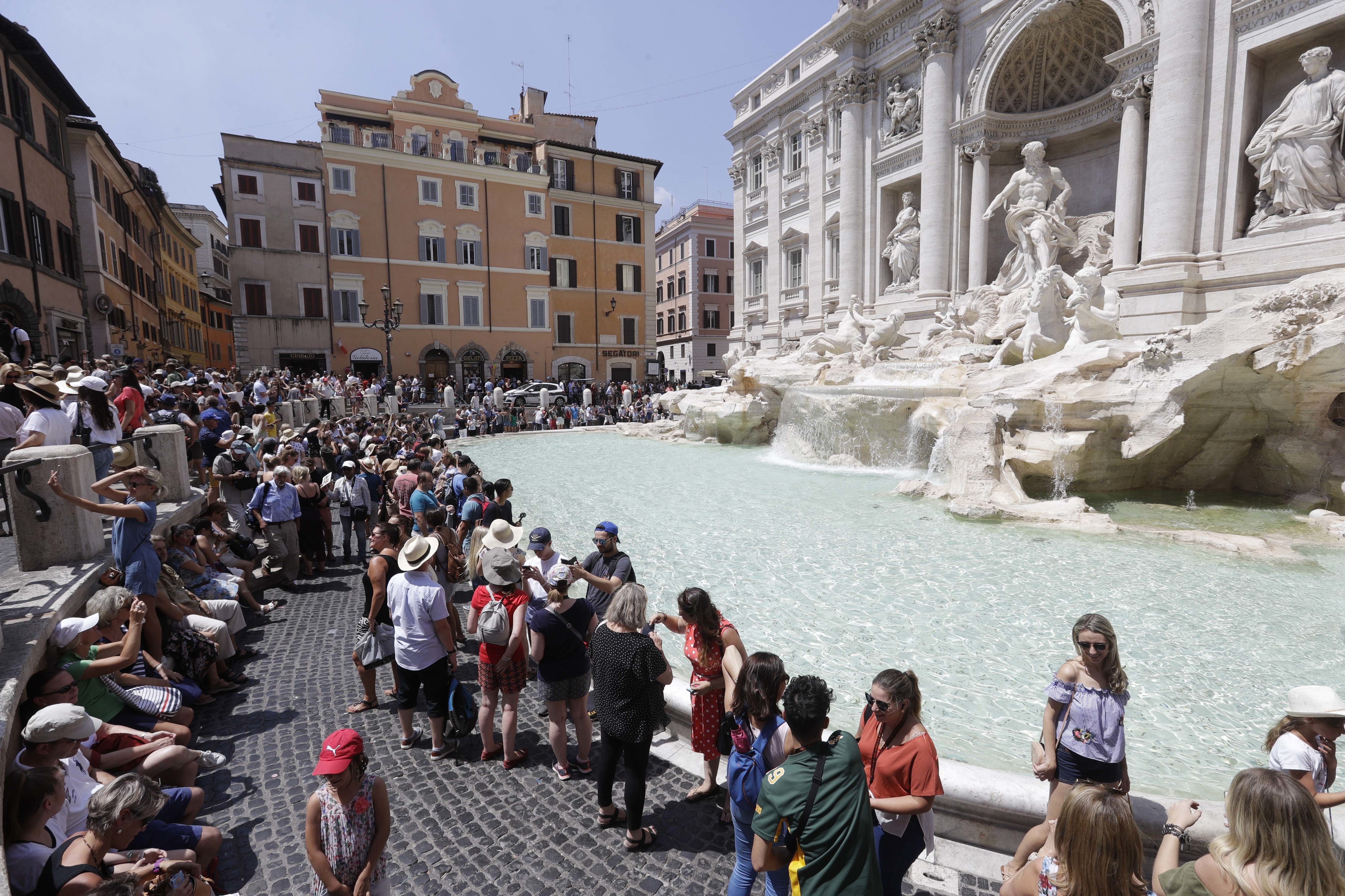 Retired police go on tourist patrol at Rome's Trevi Fountain
