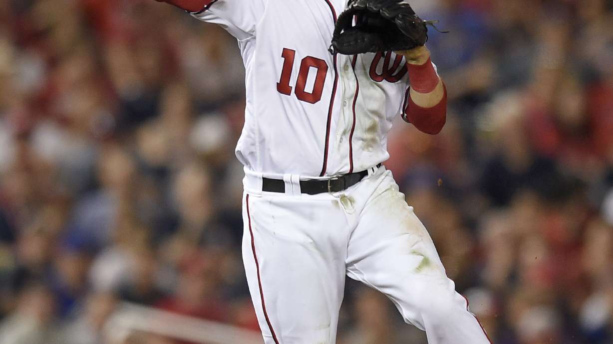 Davies, power bats launch Brewers over Nationals 8-0