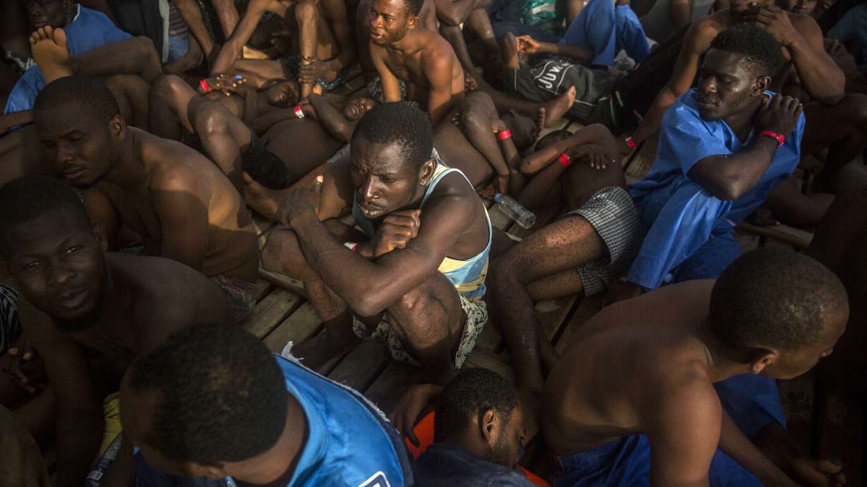 The Latest: Milan police detain 36 at migrant meeting spot