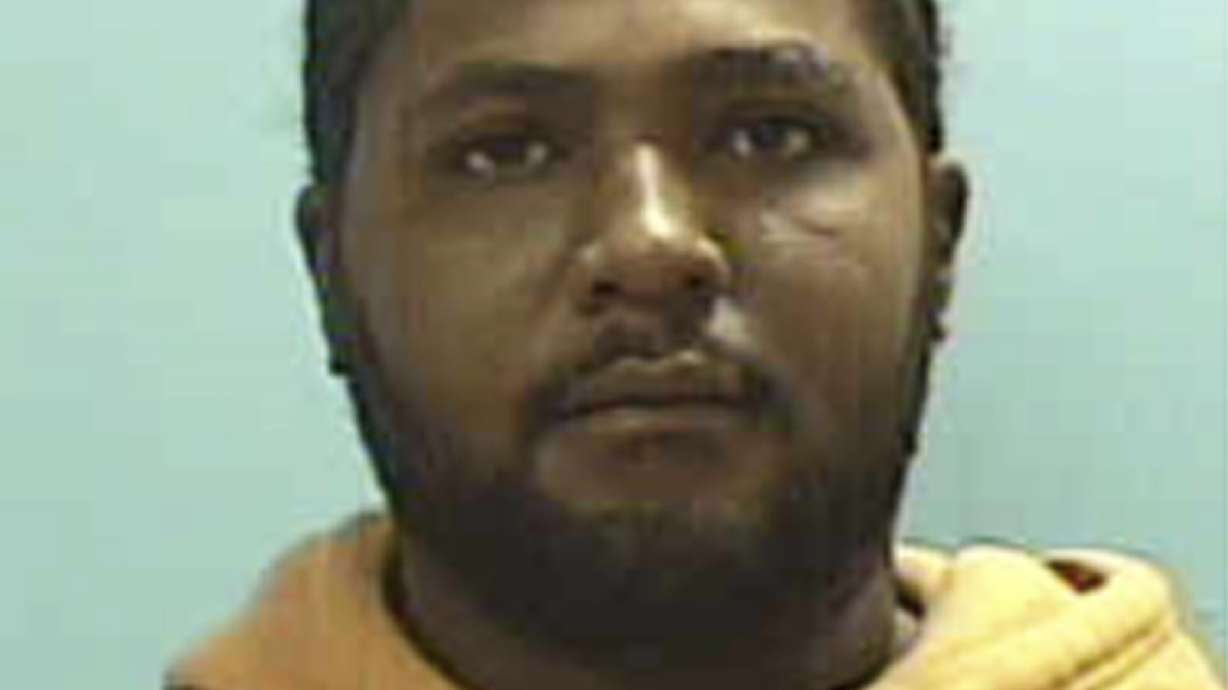 The Latest: Man charged with killing 8 to face grand jury