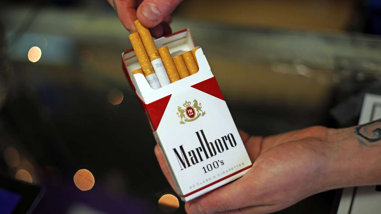 Altria 2Q profit rises on higher cigarette prices, beer