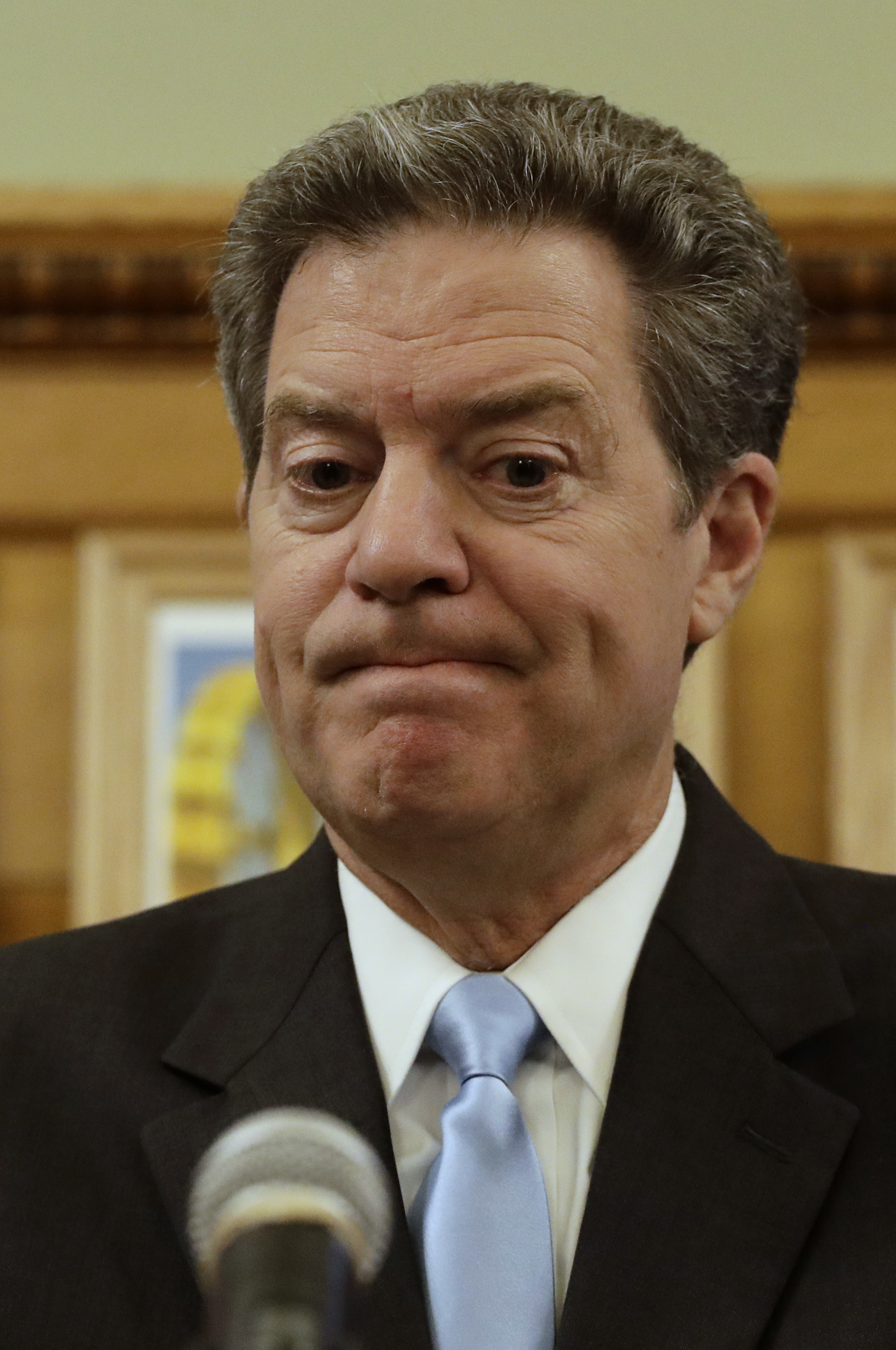 Kansas' Brownback still touts tax cuts as he heads to exit