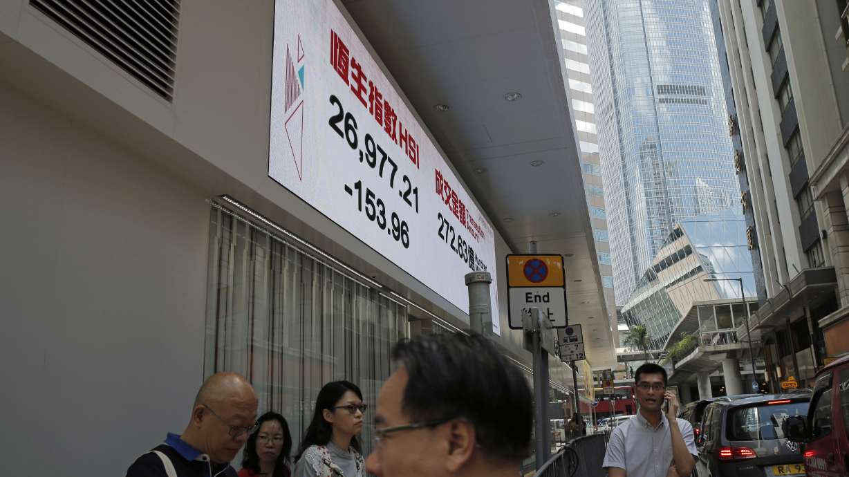 Stock markets slide as tech earnings underwhelm