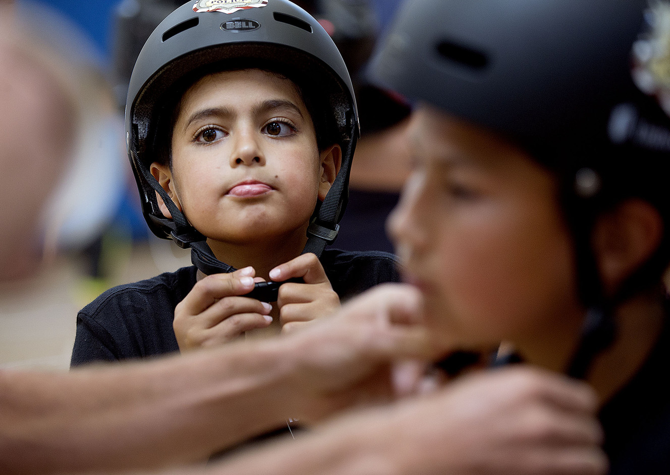 Kids get heads up on bike safety with new helmets