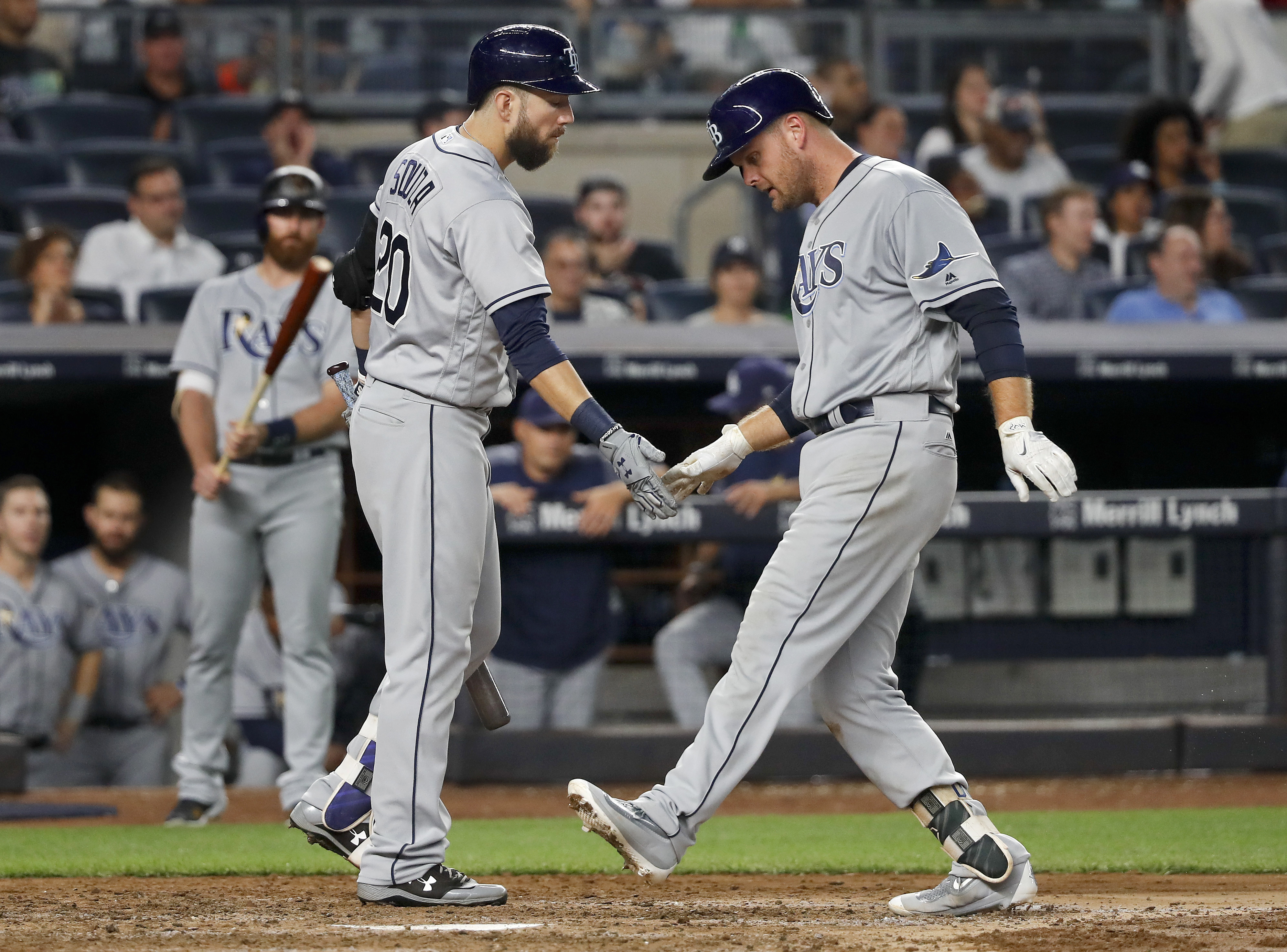 Tanaka perfect into 6th, Yanks top Rays 6-1 to regain lead