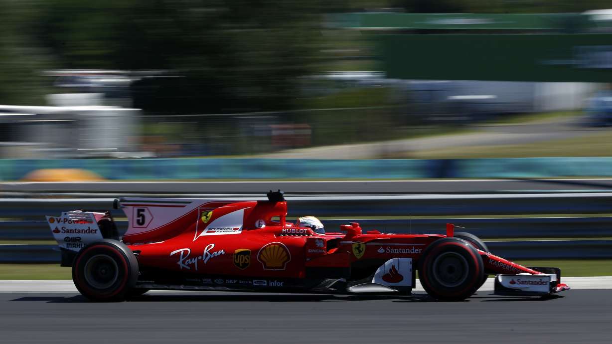 Vettel gets pole position, while Hamilton misses pole record