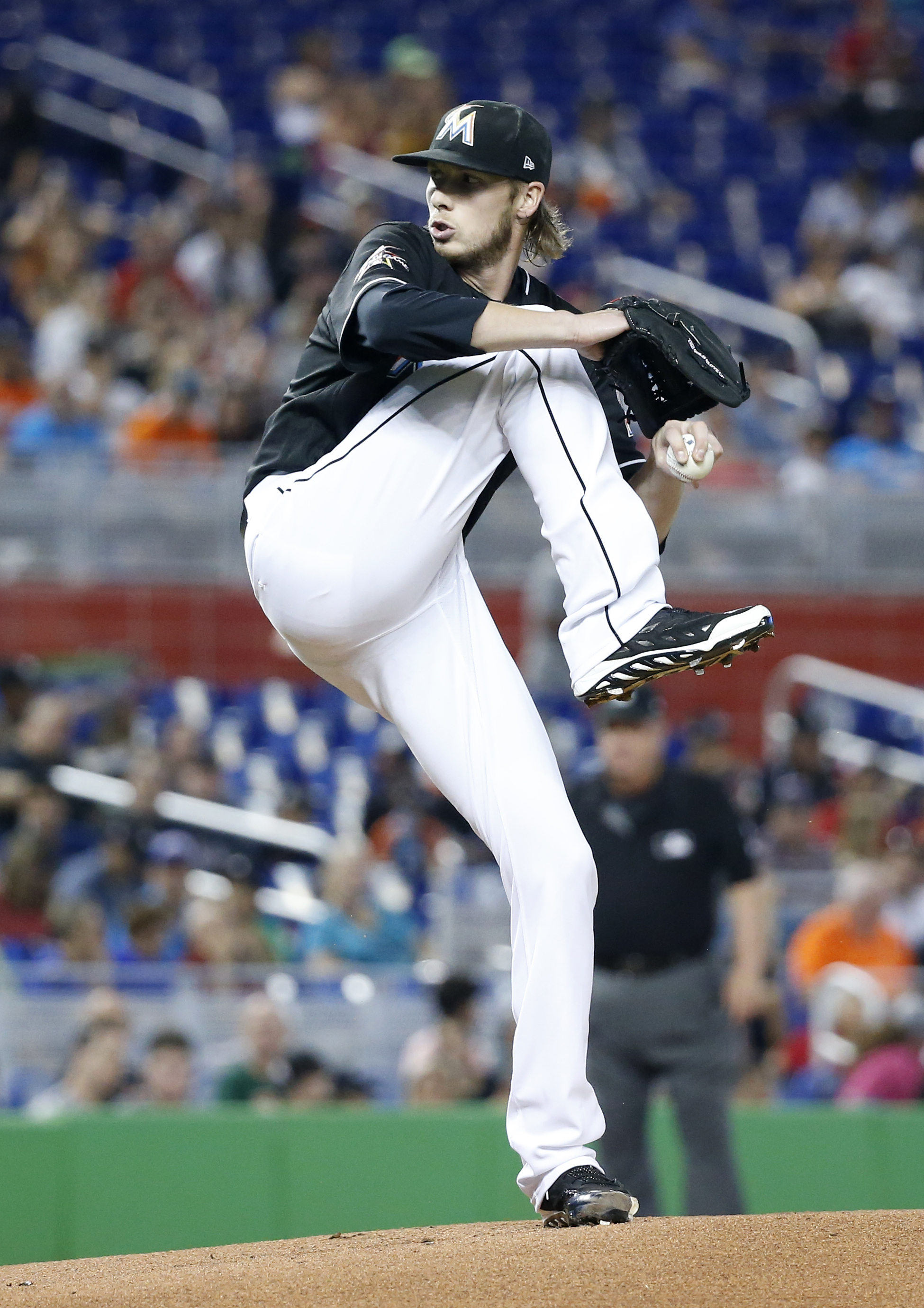 Conley strikes out seven, lifts Marlins past Reds, 7-3