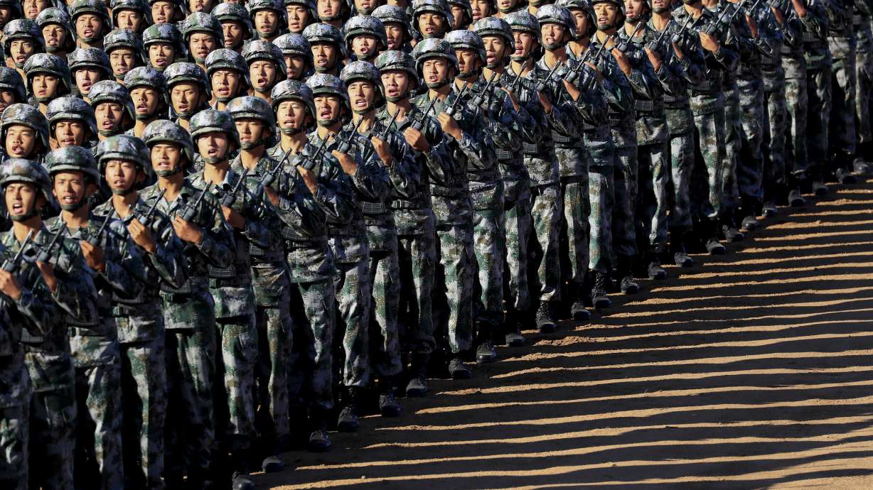 Chinese president oversees military parade in show of might