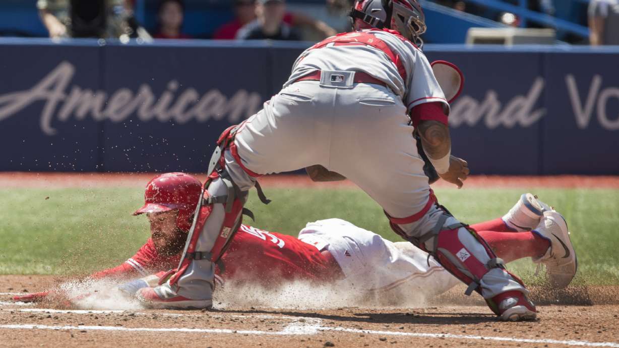 Pearce slams again, Jays score 7 in 9th, beat Angels 11-10