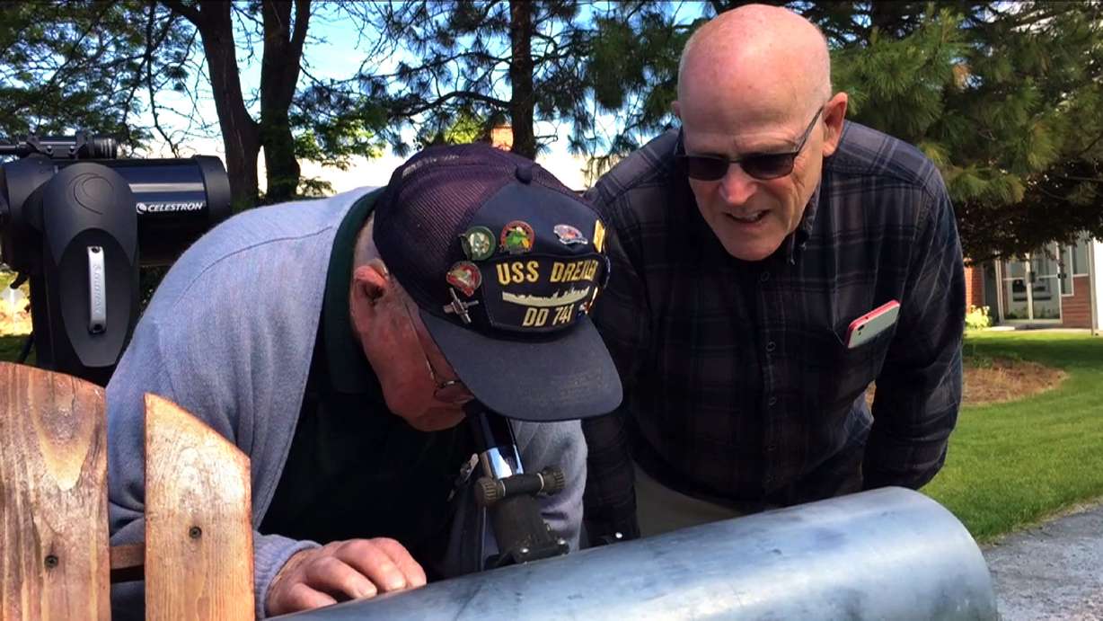 Gene Brick, 92, left, and his son, Bartt Brick, peer through a telescope in Madras, Ore., June 12, 2017, that they made together in 1964. Photo: AP Photo