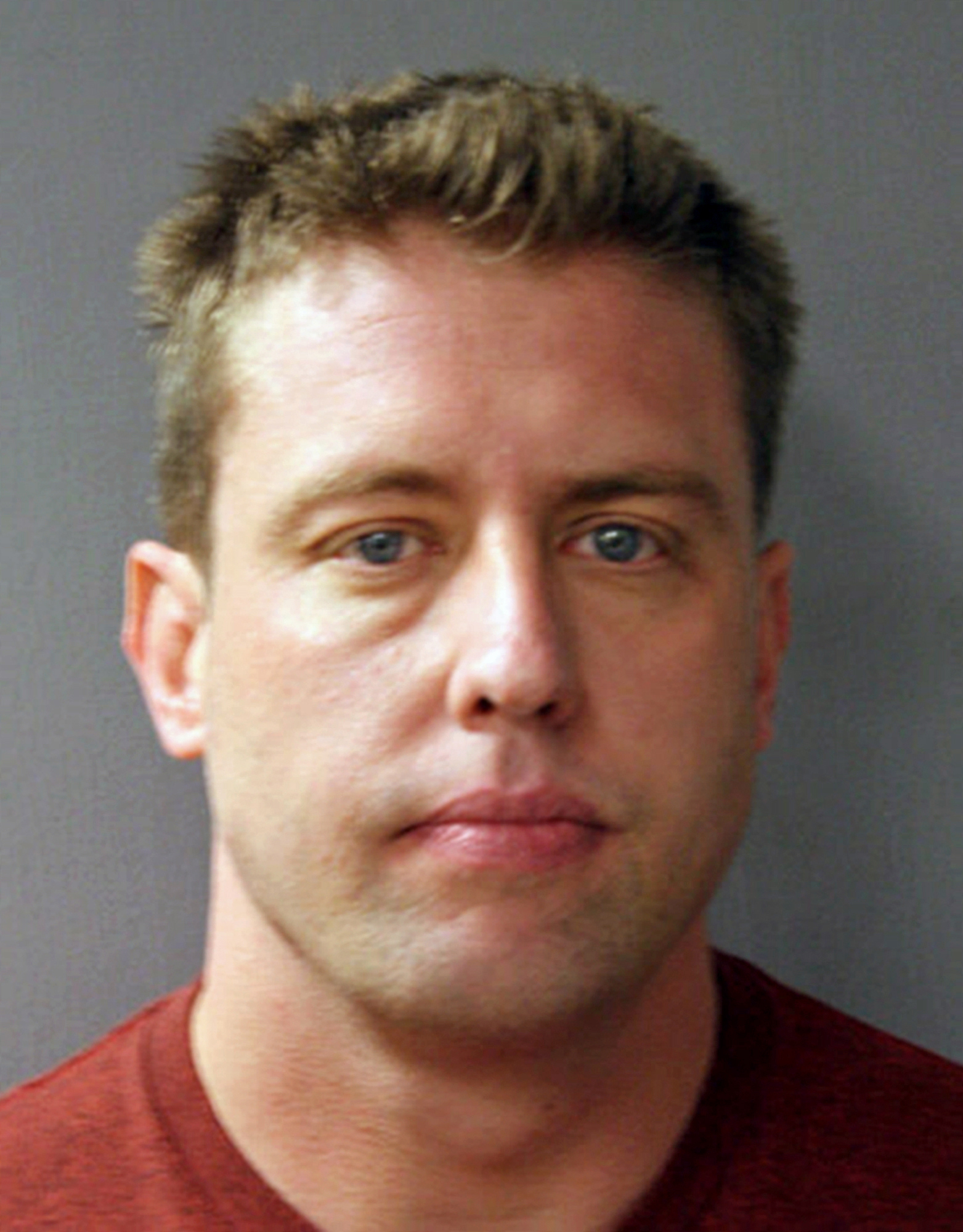 The Latest: Man shot by officer was unarmed, witness says
