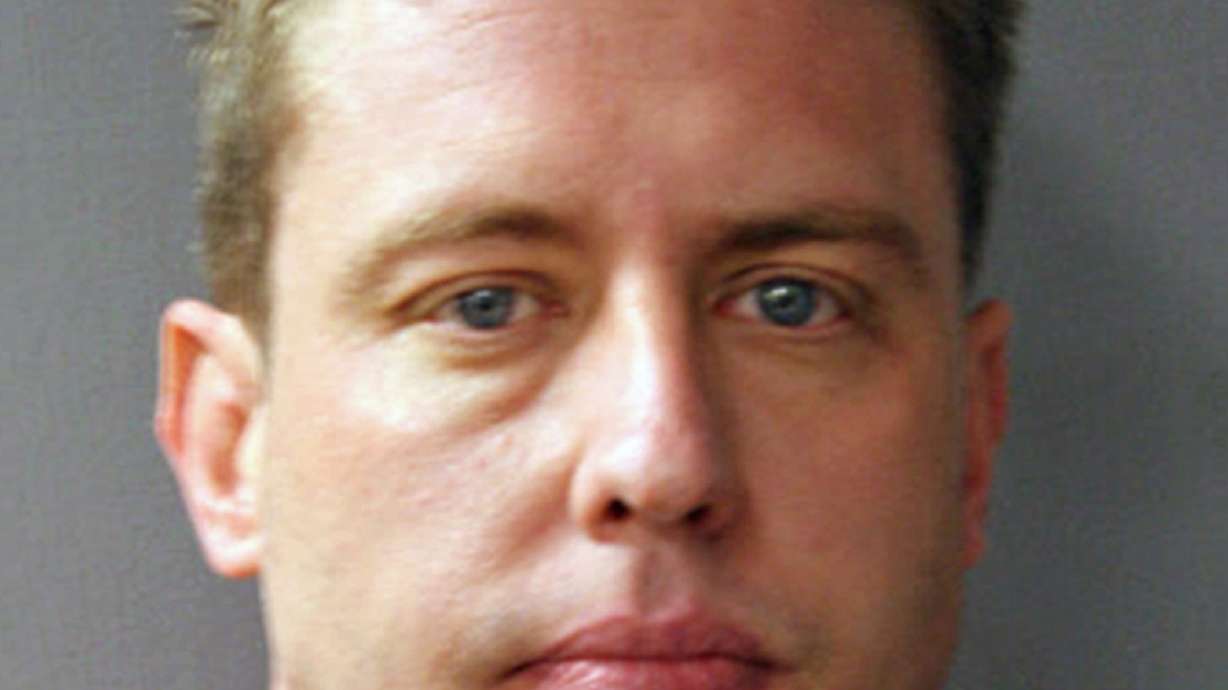 The Latest: Man shot by officer was unarmed, witness says