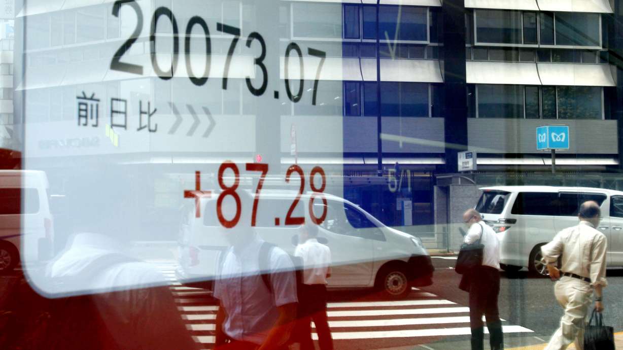 Global stocks mostly lower ahead of US jobs data