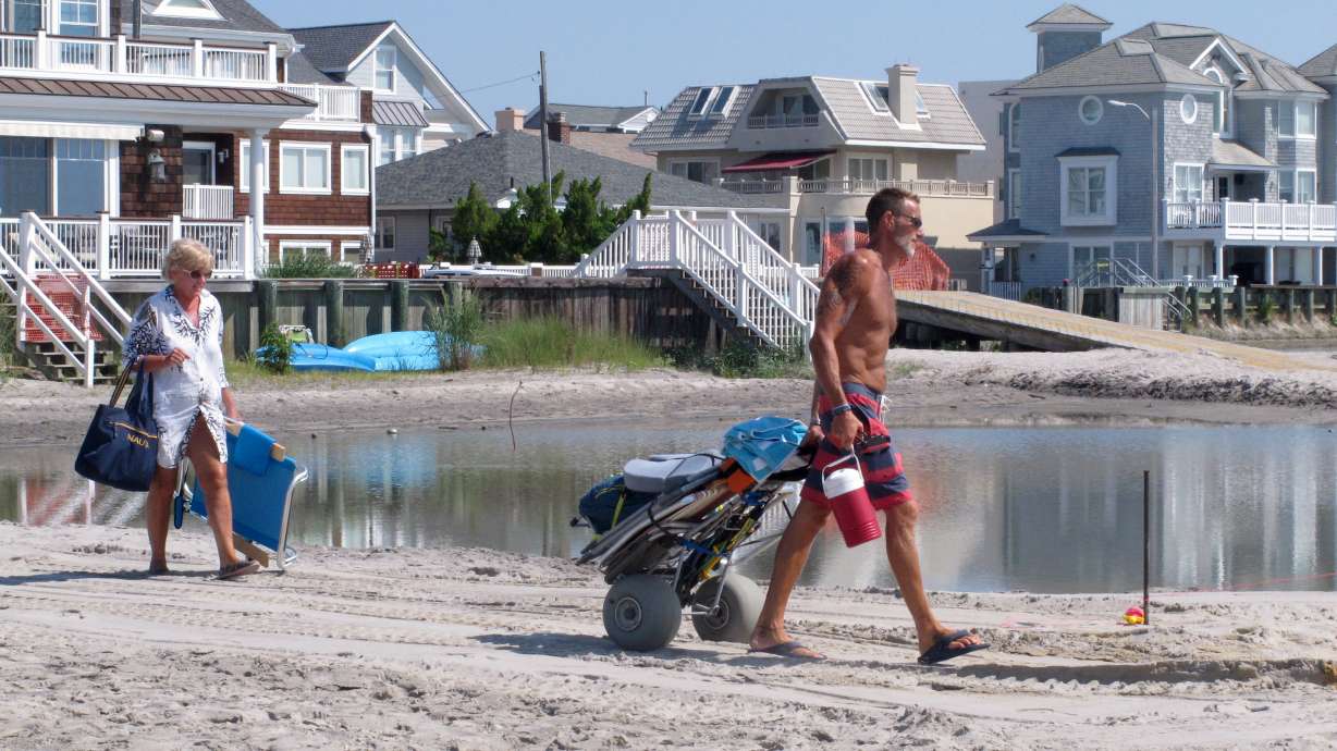 Soggy shore town OKs renewed court fight against dunes