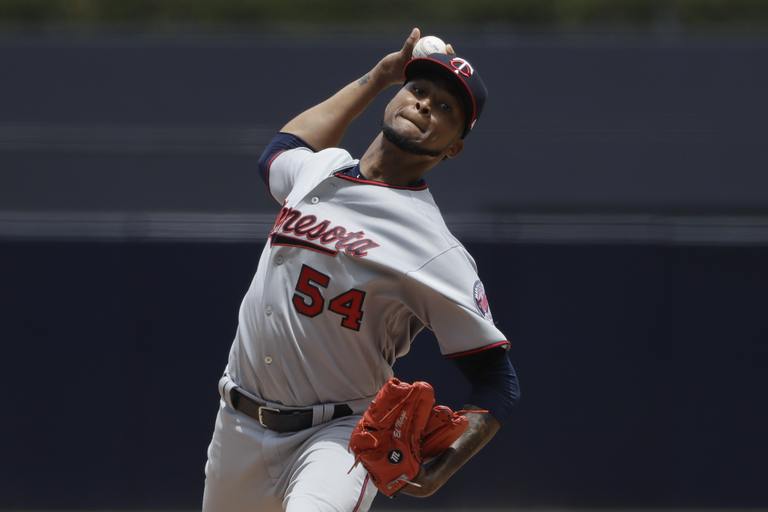 Santana throws 4-hitter, drives in 2 runs in Twins' 5-2 win