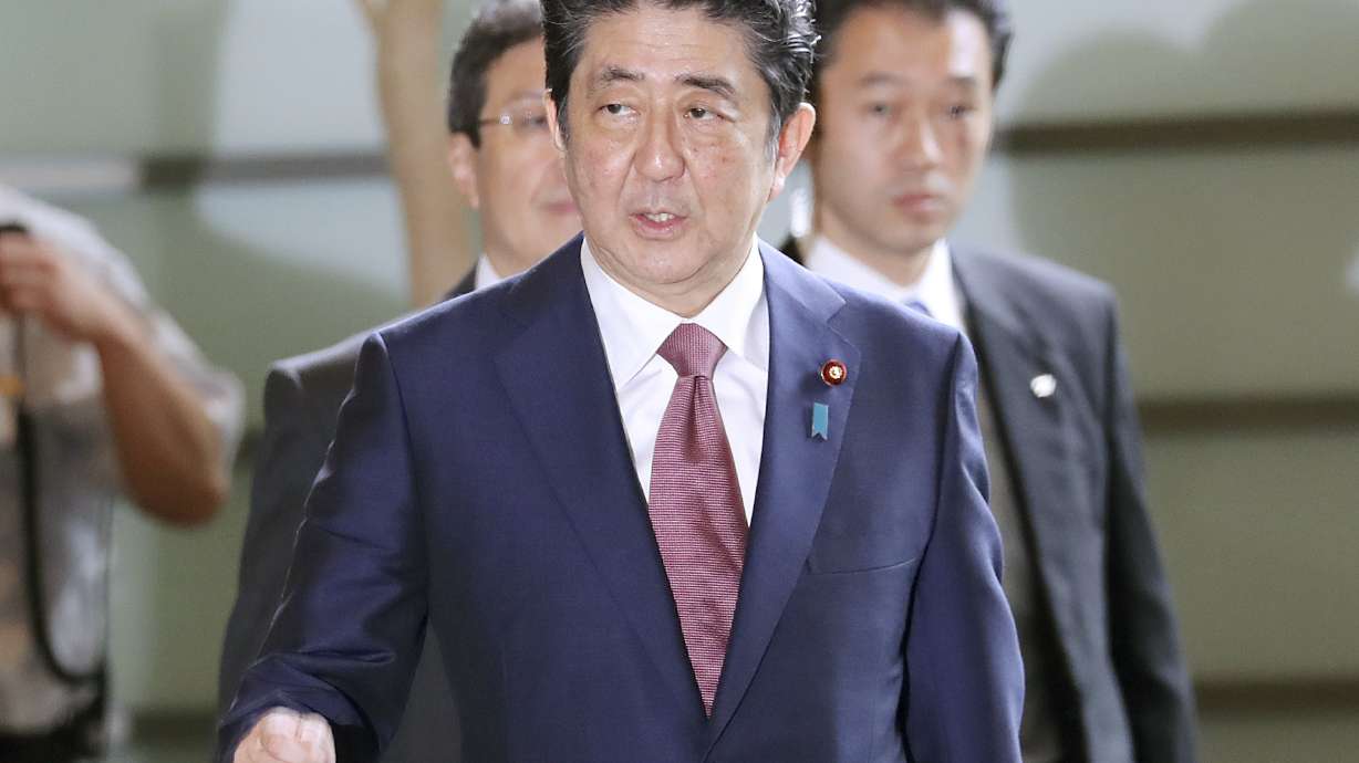Japan's Cabinet gets makeover as support for Abe dips