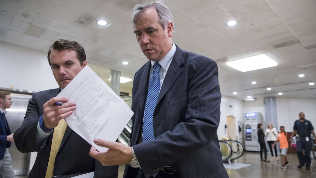 Trump grudgingly signs Russia sanctions bill