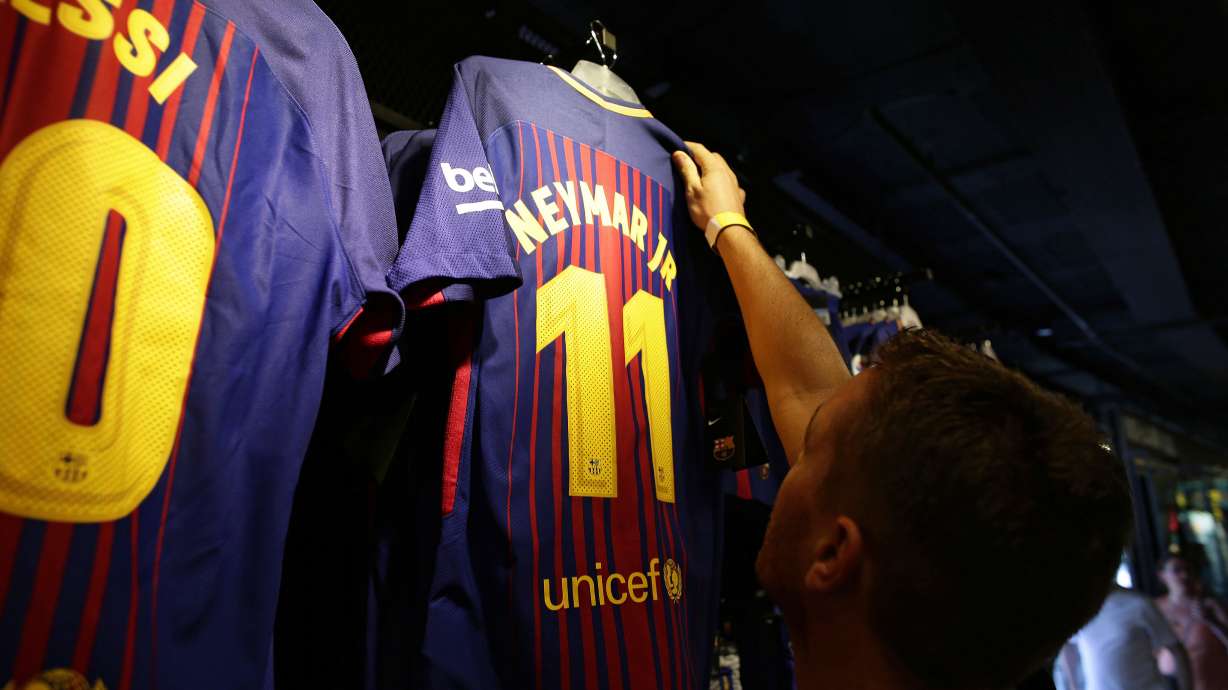 Neymar signs 5-year deal with PSG in world-record transfer