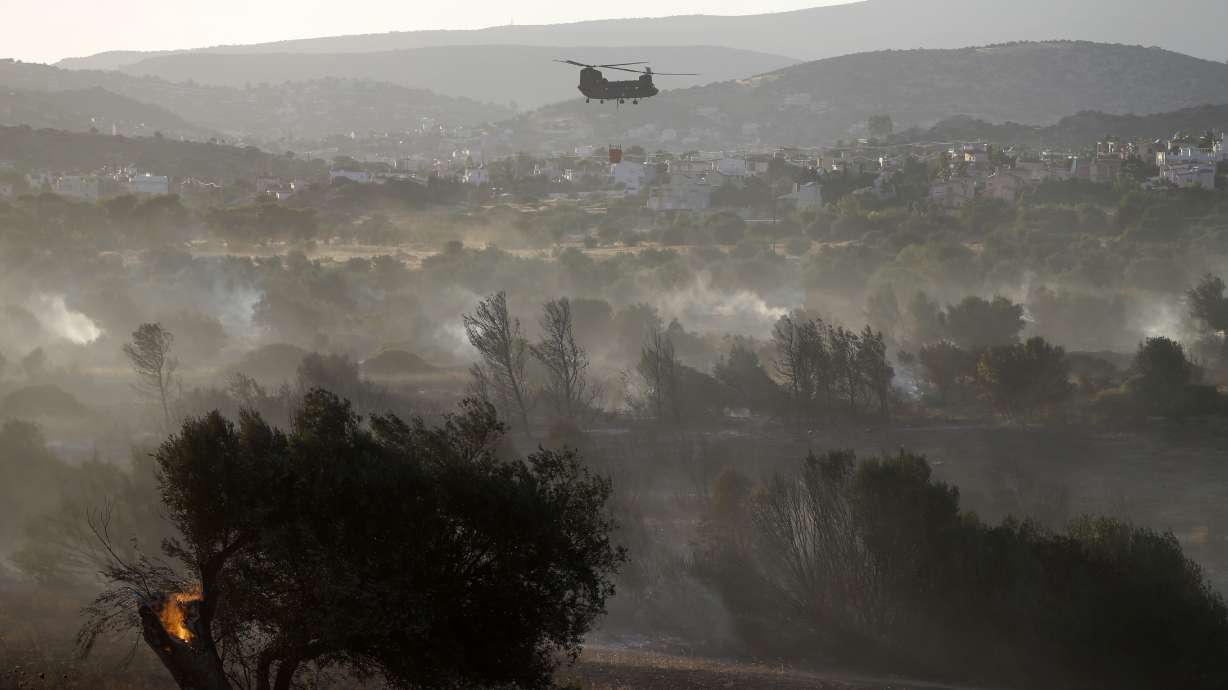 The Latest: Wildfires in Albania threaten a national park