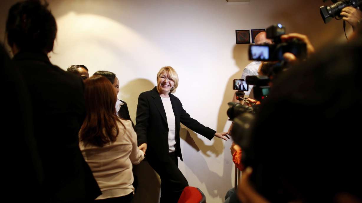 The Latest: Spanish Embassy in Venezuela hit with explosives