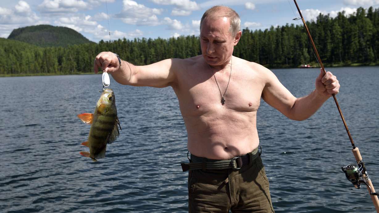 Russia's Putin shows off spoils from Siberia fishing trip