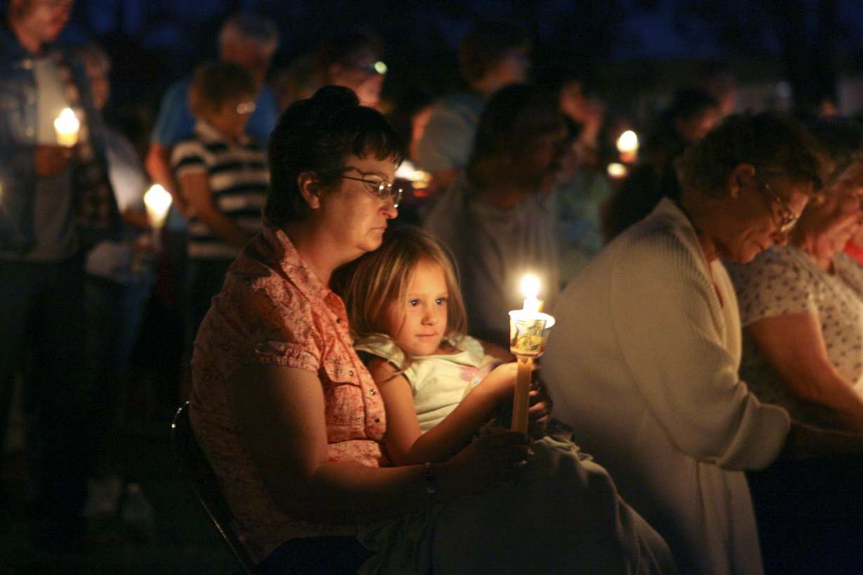 People in the mining community of Huntington, Utah, come together for a candle light vigil for the six coal miners trapped in the Crandall Canyon Mine Friday, Aug. 10, 2007. (Photo: Rick Bowmer, AP)
