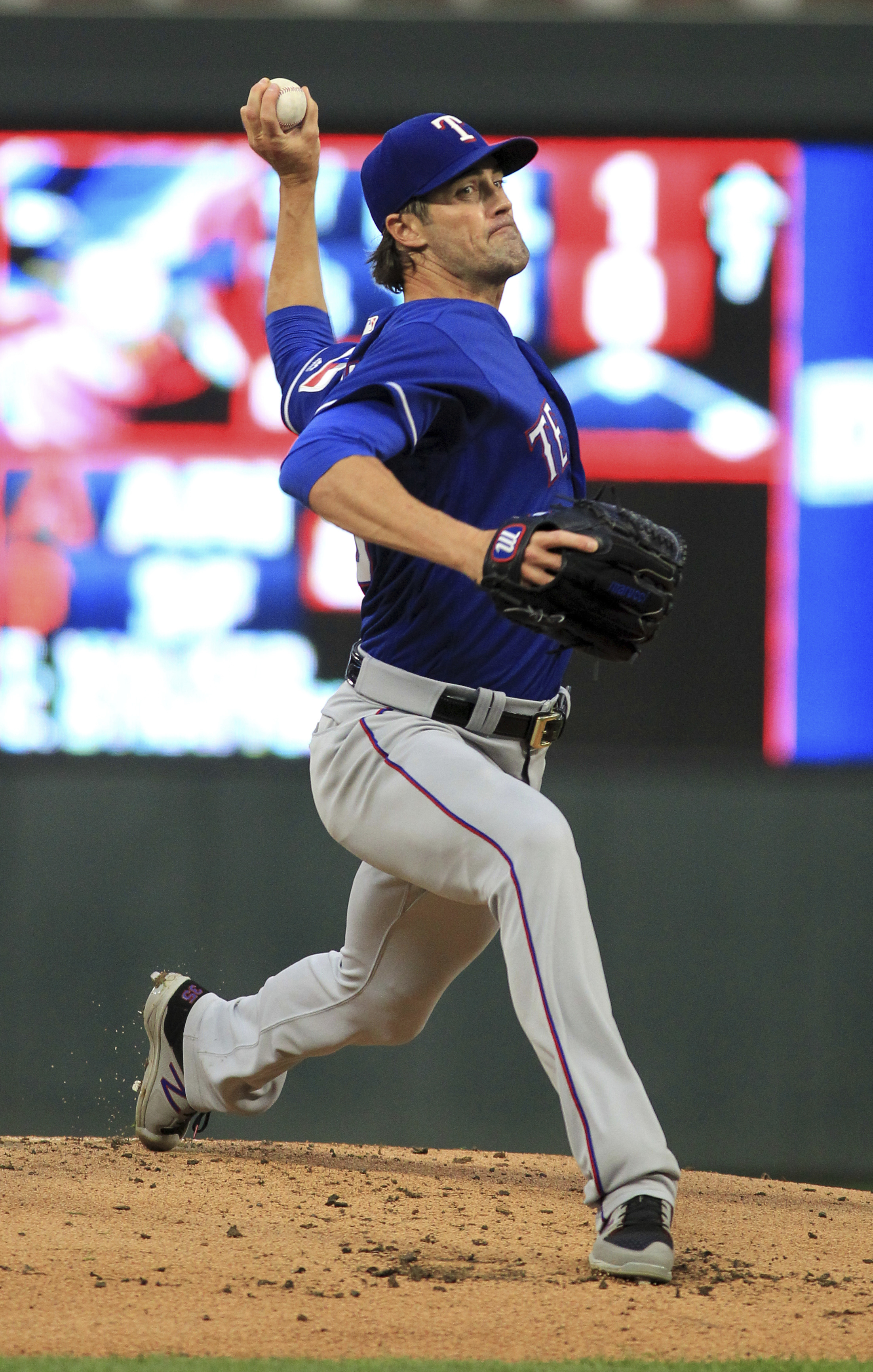 Hamels throws complete game No. 16 as Rangers beat Twins 4-1