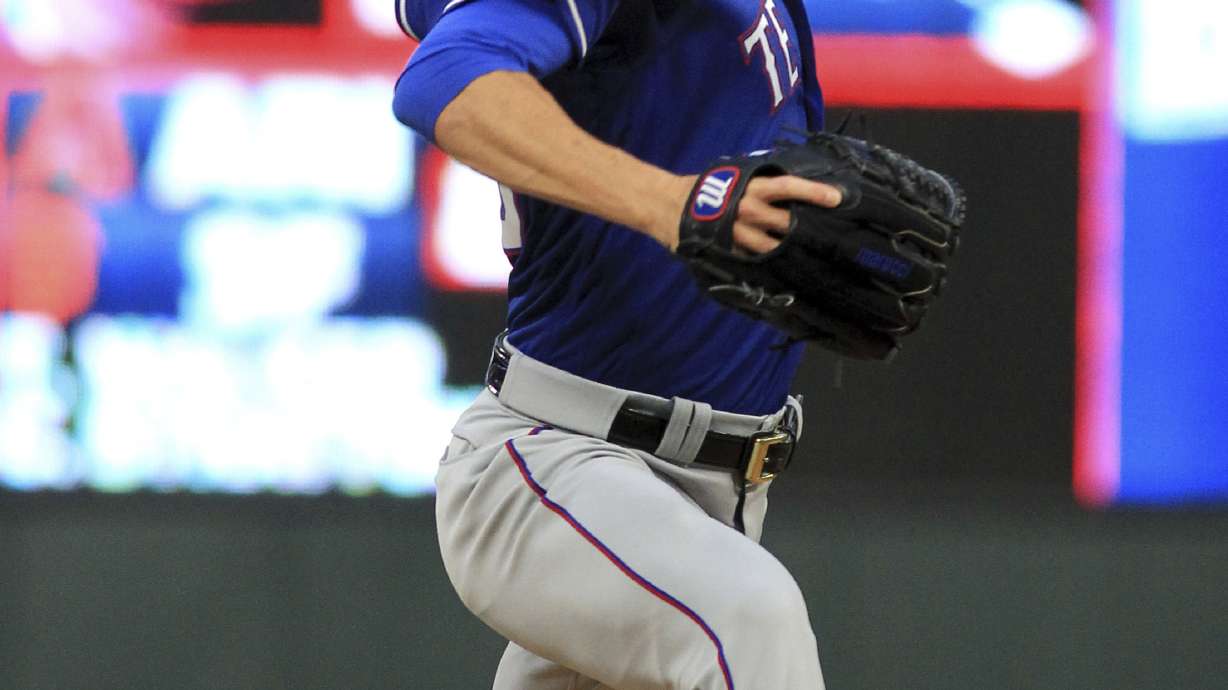 Hamels throws complete game No. 16 as Rangers beat Twins 4-1