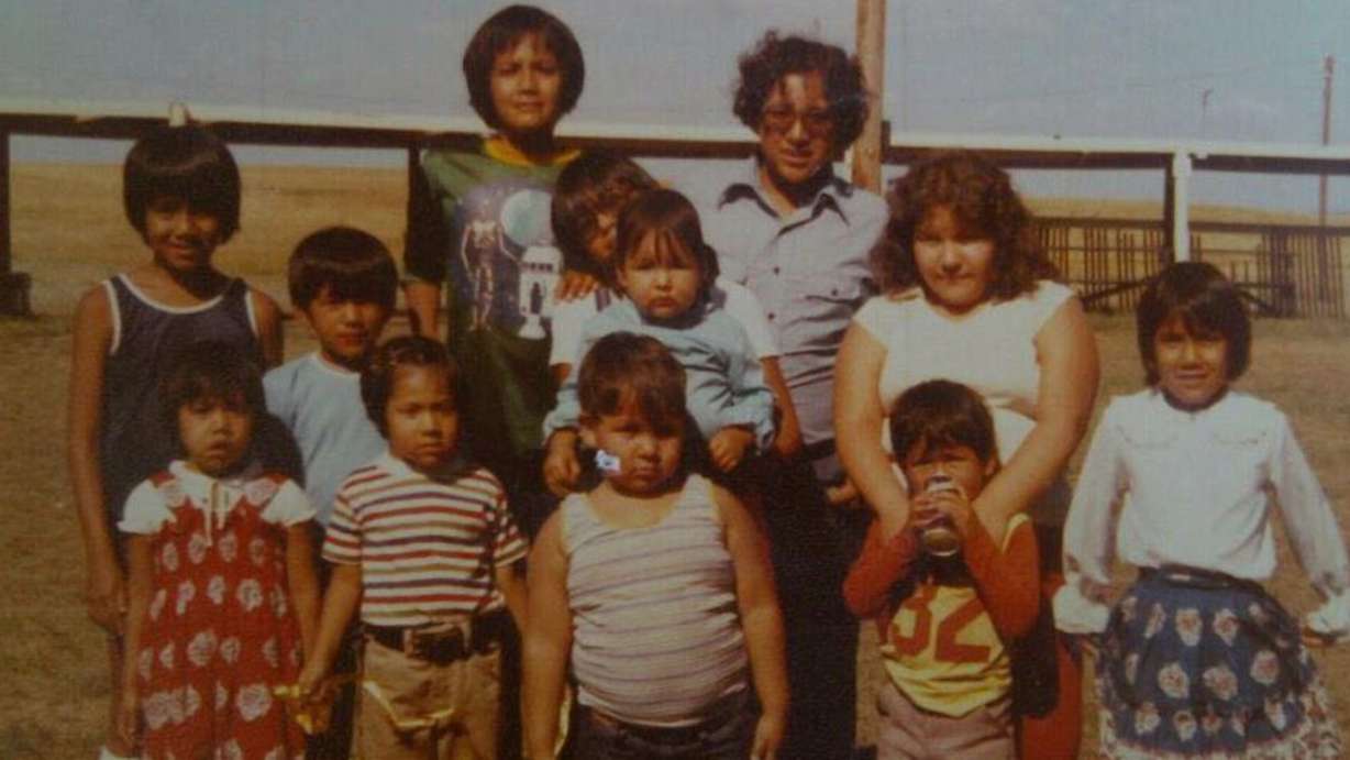 Bleu Adams, bottom left, with her family on the Navajo Nation Reservation. (Photo: Family Photo)