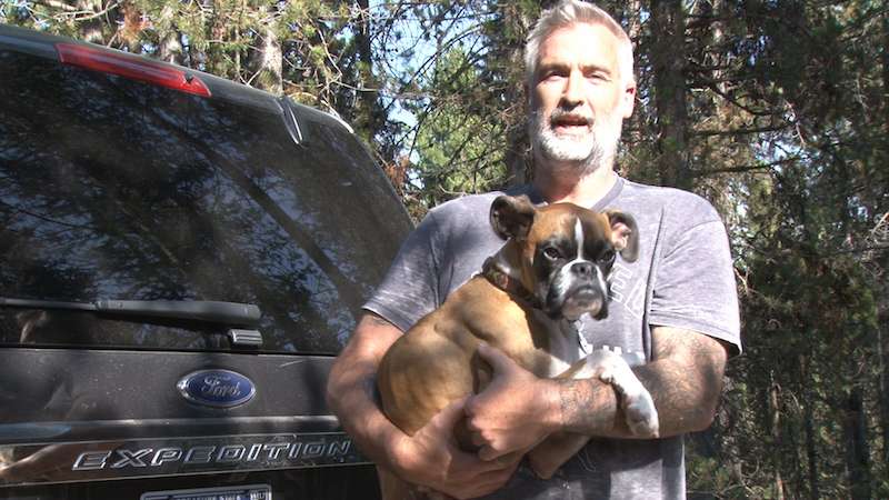 Gary Walters with his 4-year-old boxer Duncan Lou Who. Photo: Nate Eaton, EastIdahoNews.com.