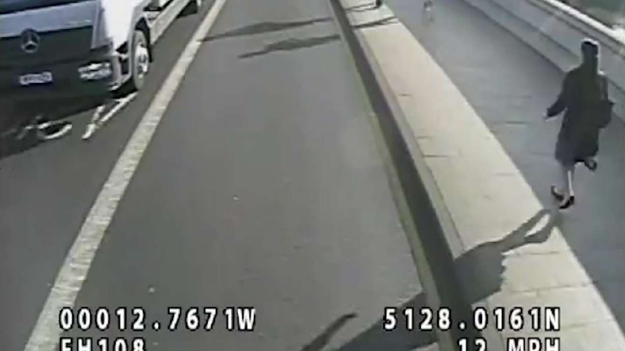 UK police seek jogger who pushed woman into path of bus