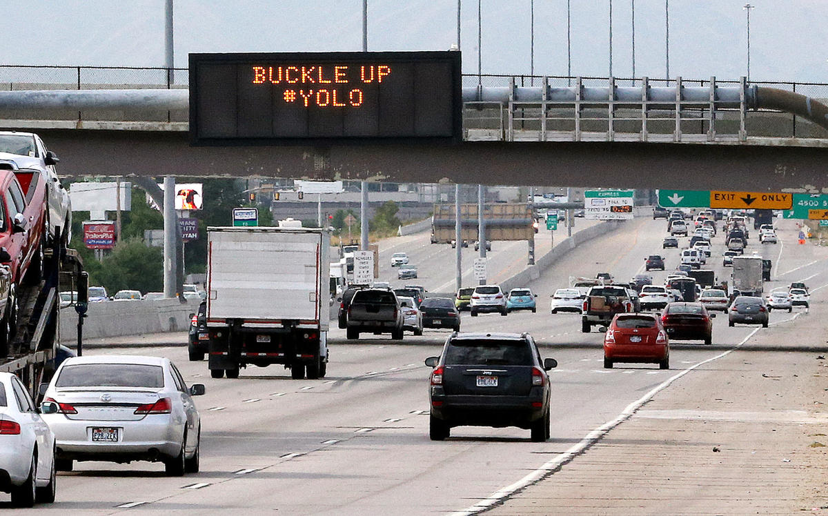 Who writes the clever road warnings that appear over Utah's highways?