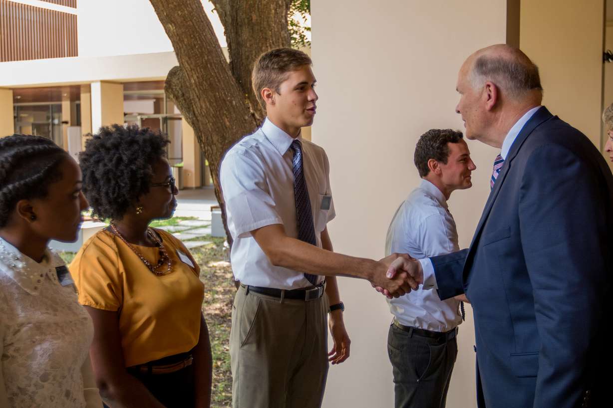 Elder Dale G. Renlund of the Quorum of the Twelve Apostles greets missionary tour guides during the Ghana Missionary Training Center open house Monday, Aug. 7, 2017. Photo: Intellectual Reserve Inc., All rights reserved.