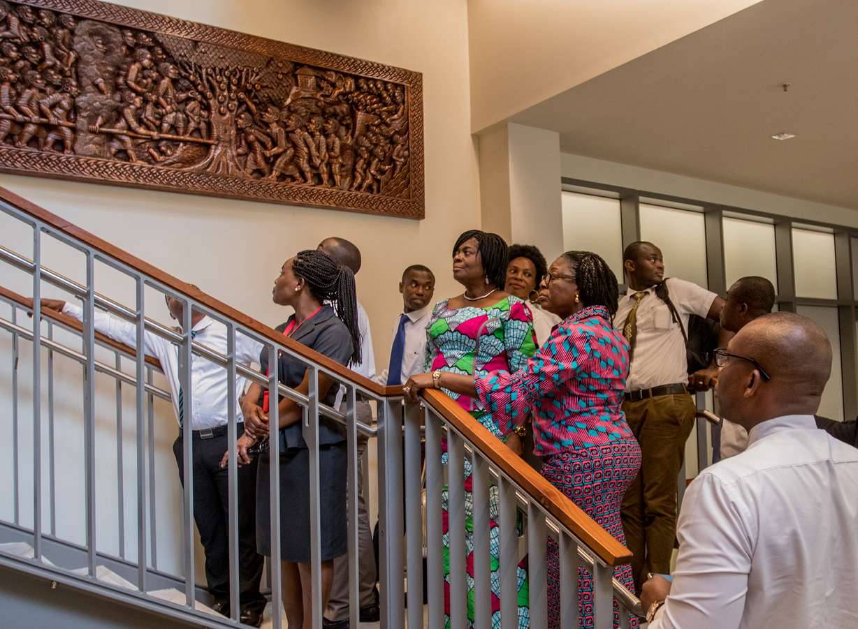 Chief Director Adelaide Anno-Kumi (center) of the Ministry of the Interior looks at a hand carved picture during an open house at the Ghana Missionary Training Center Monday, Aug. 7, 2017. Photo: Intellectual Reserve Inc., All rights reserved.