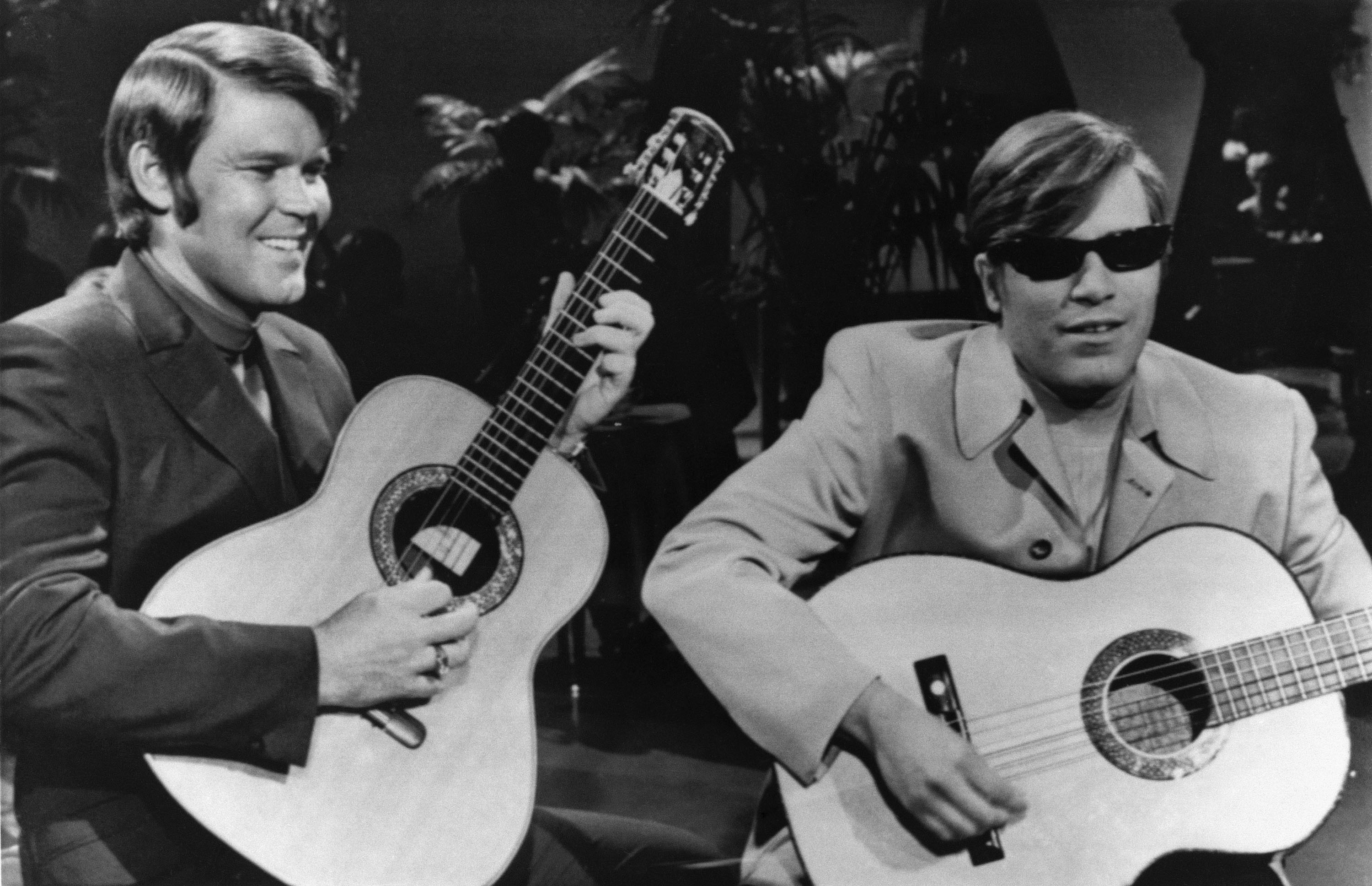 FILE - Singers Glen Campbell, left, and Jose Feliciano appear on Glen Campbell's television program, Feb. 11, 1969. (AP Photo)