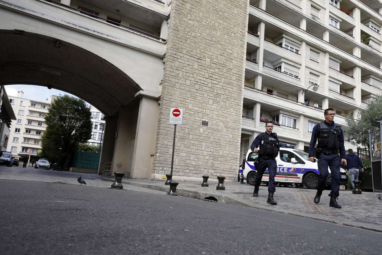 French police officers work near the scene where French soldiers were hit and injured by a vehicle in the western Paris suburb of Levallois-Perret near Paris, France, Wednesday, Aug. 9, 2017. Photo: AP Photo