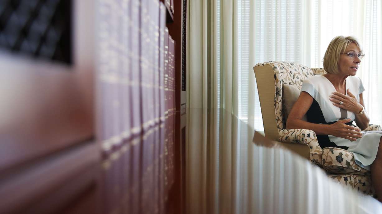 AP Interview: DeVos says she didn't decry racism enough